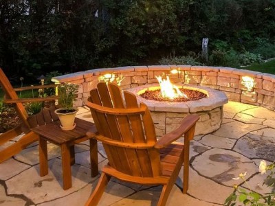 Paver patio seat wall fire pit and landscape lighting 