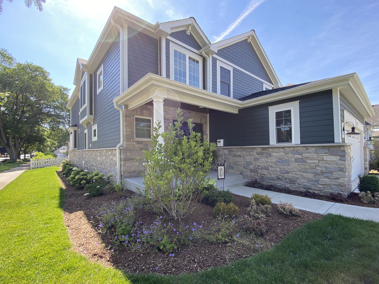 Front house view with new planting beds and mulch 