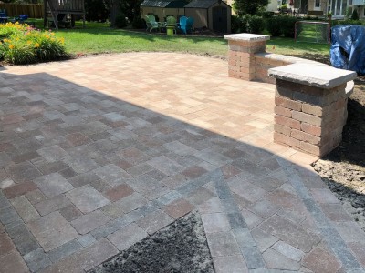 Paver patio seat wall and pillars using Brussels Block and Brussels Dimensional Stone by Unilock 